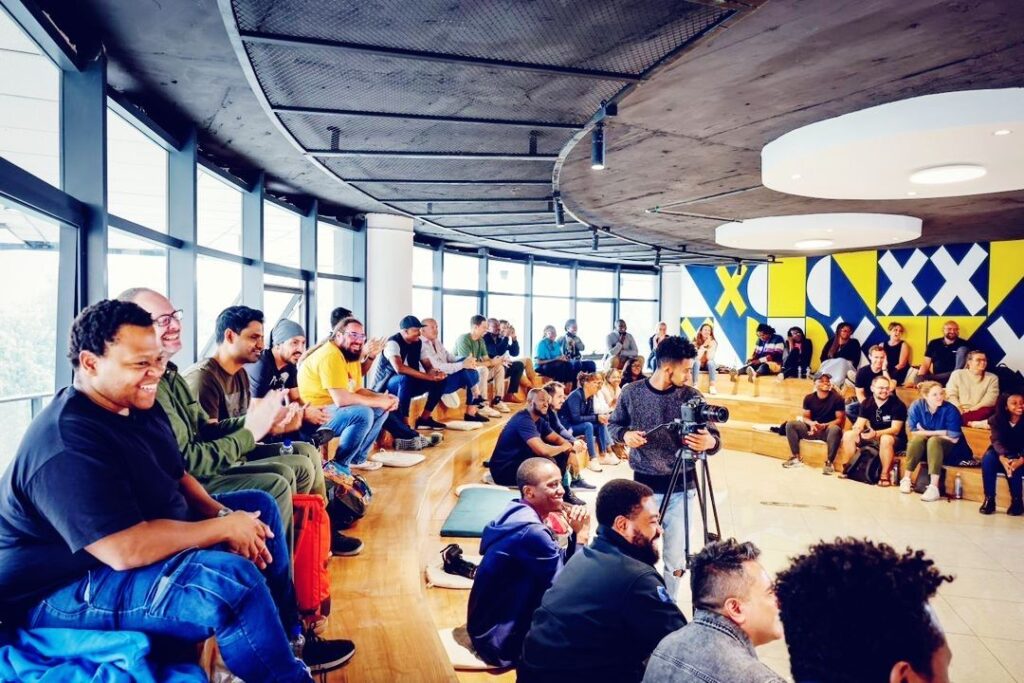 ALX staff sitting in a mini amphitheatre setting at the Addis hub | Karibu 2023