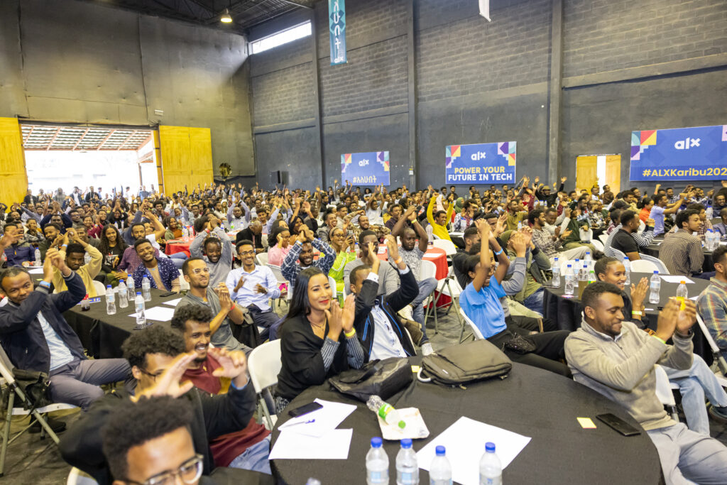 Several ALX learners clapping their hands at the Karibu ceremony in Addis Ababa